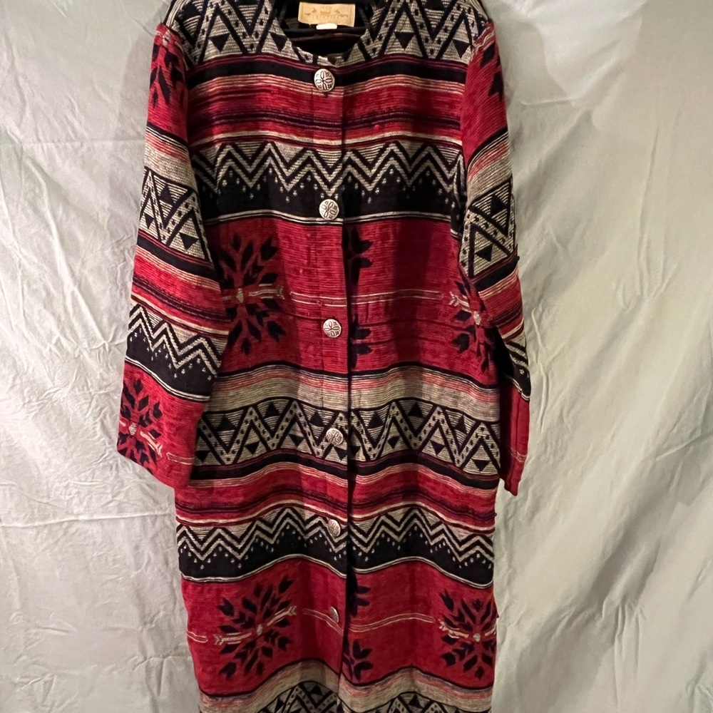 This is a vintage New Frontier red and black patterned cardigan